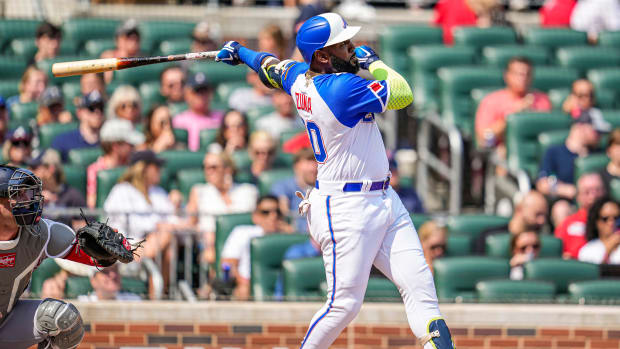 Jun 10, 2023; Cumberland, Georgia, USA; Atlanta Braves designated hitter Marcell Ozuna (20) hits a home run against the Washington Nationals during the second inning at Truist Park. Mandatory Credit: Dale Zanine-USA TODAY Sports